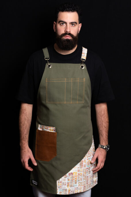 Enhance your work attire with our premium olive green canvas apron. Ideal for waiters, bartenders, hairdressers, florists, gardeners, and more. Adjustable straps ensure a comfortable fit, while leather brown pockets add style and functionality. Elevate your professional look with this versatile and durable apron.