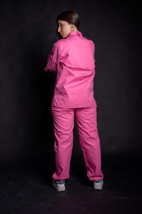 Loose fit street wear clothes in black background. Custom shirt in pink color.