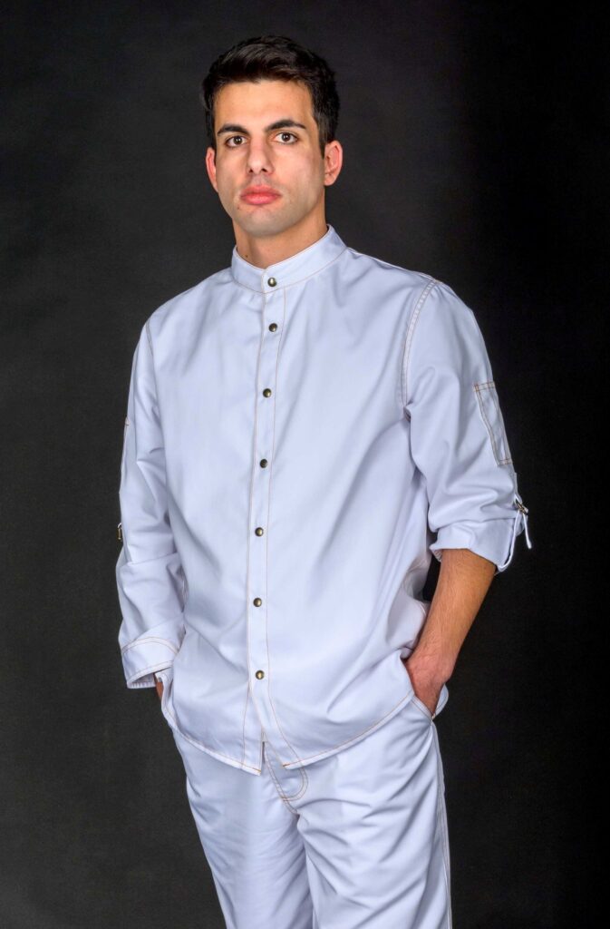 Man wearing beautiful bakery clothes, made from medium weight durable white fabric. Personalized shirt with customizable options, breathable and comfortable to wear all day.