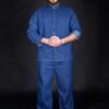 Man wearing high quality work clothes with personalized details. His work shirt has long sleeves that can be folded up to short sleeves too, supported by a metal bronze slide buckle.