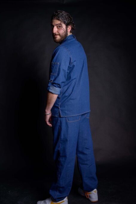 Stylish workwear that can be worn as street wear clothes as well. Barista wearing his custom shirt with matching blue denim pants.