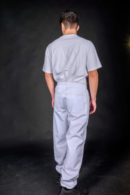 Stylish unisex white pants with two back pockets and elastic waist for customizable fit.