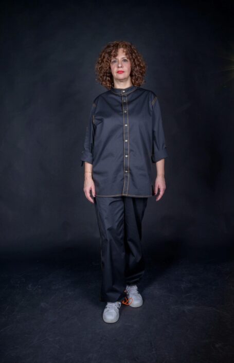 Work clothes that can be worn as street wear clothes as well. Woman wearing stylish workwear, made from durable black fabric.
