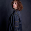 Custom chef coat with multi purpose options. Woman wearing chef jacket with two small pockets on both sleeves.