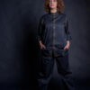 Baker wearing her bakery clothes, made from breathable black fabric. She can wear them daily, because they’re comfortable and stylish.