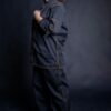 Chef wearing her chef clothes with personalized details. Her chef shirt has long sleeves that can be folded up to short sleeves too, supported by a metal bronze slide buckle.