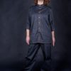 Barista wearing work shirt, with stylish mao collar and metal bronze stud buttons. Uniquely designed custom shirt, ideal for everyday use in restaurants and kitchen.